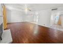 Spacious living room with wood flooring, fireplace and lots of natural light from the back door at 5305 Alta Dr, Las Vegas, NV 89107