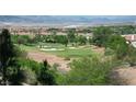 Scenic golf course view showcasing lush greens, sand traps and beautiful mountain backdrop at 64 Strada Principale # 307, Henderson, NV 89011