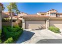 Charming townhome featuring a two-car garage, and a beautiful red tile roof at 7131 Mission Hills Dr, Las Vegas, NV 89113