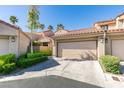 Charming townhome featuring a two-car garage, and a beautiful red tile roof at 7131 Mission Hills Dr, Las Vegas, NV 89113