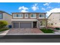 Charming two-story home featuring stone accents, two-car garage, and a well-manicured front lawn at 8415 Iron Heart Ln, Las Vegas, NV 89113