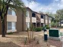 Community exterior with stucco facade, arched entryways and mature trees at 9000 Las Vegas Blvd # 1271, Las Vegas, NV 89123