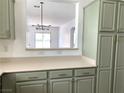 View from kitchen into open space, featuring modern chandelier at 9236 Canalino Dr, Las Vegas, NV 89134