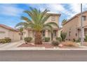 Beautiful two-story home with a well-manicured lawn and desert landscaping in the front yard at 9788 Altadena St, Las Vegas, NV 89183