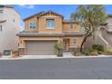 Charming two-story home with a two-car garage, landscaped yard, and inviting entrance at 10729 Red Badge Ave, Las Vegas, NV 89166