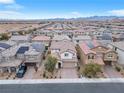 Expansive aerial view of a residential neighborhood showcasing the house and surrounding area at 10946 Mount Goyer St, Las Vegas, NV 89141