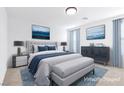 Serene main bedroom with elegant decor, comfortable bedding, and soft, natural lighting at 10946 Mount Goyer St, Las Vegas, NV 89141