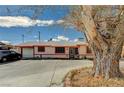 Cozy single-story home with a detached garage, ample parking, and a well-maintained front yard at 111 Narcissus Ln, Las Vegas, NV 89107