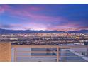 Breathtaking city views from this rooftop deck provide a stunning backdrop for entertaining and relaxing at 11676 Midnight Melody Ave, Las Vegas, NV 89138