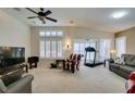Spacious living room with a ceiling fan and plantation shutters for natural light at 2007 High Mesa Dr, Henderson, NV 89012