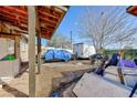 Spacious backyard with laundry hookups, covered area, and plenty of storage space at 2054 Harvard St, North Las Vegas, NV 89030