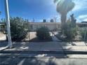 Quaint single-story home enclosed by a chain-link fence with a gravel yard at 2108 E Ogden Ave, Las Vegas, NV 89101