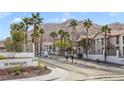 Inviting entrance to Sunrise Bay featuring mature palm trees and mountain views at 2110 Los Feliz St # 2064, Las Vegas, NV 89156
