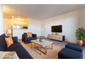 Inviting living room featuring stylish blue seating, a modern coffee table, and contemporary decor at 231 W Horizon Ridge Pkwy # 1011, Henderson, NV 89012