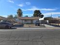 Modest single-story home with dual carport and a chain-link fenced yard at 2481 San Marcos St, Las Vegas, NV 89115