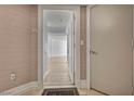 Apartment 301 entrance featuring a light-colored door and views of the interior with wood floors at 2777 Paradise Rd # 301, Las Vegas, NV 89109