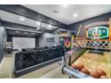 Finished game room with basketball arcade, projector and movie screen at 3911 Kamden Way, Las Vegas, NV 89119
