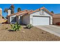 Inviting single-story home featuring a low-maintenance desert landscape and a two-car garage at 4130 Lucas Ave, Las Vegas, NV 89120