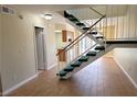 The view of the entryway reveals the home's staircase with new carpet at 530 Sellers Pl, Henderson, NV 89011