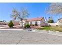 Pleasant single-story home with a red tile roof and drought-resistant landscaping at 5927 Tropical Palm Ct, North Las Vegas, NV 89031