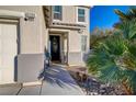 Charming entrance with a decorative front door, welcome sign, and well-kept landscaping at 6104 Talbot Springs Ct, North Las Vegas, NV 89081