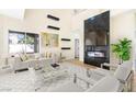 Bright living room features modern furniture and sleek fireplace design at 6628 Silver Penny Ave, Las Vegas, NV 89108