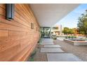 Outdoor space with wood accents, fire feature, and stone pathway at 7030 Schirlls St, Las Vegas, NV 89118