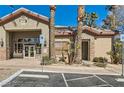 Exterior view of the community clubhouse with accessible entrance and mature landscaping at 8000 Badura Ave # 1020, Las Vegas, NV 89113