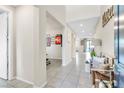Neutral entryway boasting high ceilings, tiled flooring, and modern decorations at 9675 Bold Skye Ave, Las Vegas, NV 89166