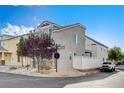 Charming two-story home featuring desert landscaping, and a side patio at 10429 Amber Night St, Las Vegas, NV 89183