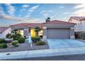 Charming single-story home features a well-manicured front yard and attached two-car garage at 10801 Clarion Ln, Las Vegas, NV 89134