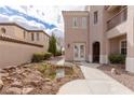 Charming home with a decorative front courtyard and a tranquil pond at 11241 Golden Chestnut Pl, Las Vegas, NV 89135