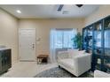 Cozy living room featuring a white chair, stylish decor, and a bright, welcoming atmosphere at 124 Strone St, Henderson, NV 89012