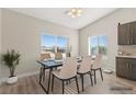 Bright dining area with a sleek table, comfortable chairs, and ample natural light at 2271 Zephyr Ave, Pahrump, NV 89048