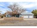 Charming single-story home showcasing a three-car garage and tidy front yard landscaping at 2281 Wagon Ave, Pahrump, NV 89048