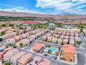 Community with a pool, desert landscaping, and mountain backdrop at 3767 Westeros Landing Ave, Las Vegas, NV 89141