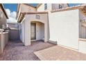Inviting front entrance with brick paved patio, leading to a modern-style front door and charming exterior design at 457 Cornelius Kelly Ave, Henderson, NV 89011