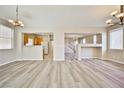 Spacious living room with abundant natural light and modern floors at 4817 Eureka Diamond Ct, Las Vegas, NV 89139