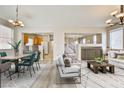 Spacious living and dining area features stylish decor and an open floor plan to the kitchen and entryway at 4817 Eureka Diamond Ct, Las Vegas, NV 89139