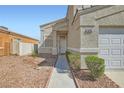 Inviting entryway with a well-maintained walkway leading to the front door of a two-story home at 5252 Mineral Lake Dr, Las Vegas, NV 89122