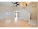 Spacious living room with high ceilings, wood floors, and abundant natural light, perfect for entertaining at 5252 Mineral Lake Dr, Las Vegas, NV 89122