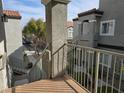 Exterior view from balcony overlooking courtyard with mature trees and neighboring buildings at 6160 Rumrill St # 207, Las Vegas, NV 89113