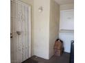 Entrance showing security gate and unit 744 with boxes near the door at 746 Anne Ln, Henderson, NV 89015