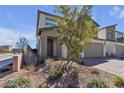 View of modern two-story home with desert landscaping at 10122 Mystic Falls Dr, Las Vegas, NV 89141