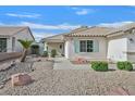 Well-maintained front yard with desert landscaping, rock features and a charming front entrance to the home at 1326 Winter Solstice Ave, Henderson, NV 89014