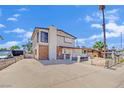 Two-story home with mixed brick and siding exterior and front yard needing revitalization at 3009 Merritt Ave, Las Vegas, NV 89102