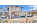 Two-story home with mixed brick and siding exterior and front yard needing revitalization at 3009 Merritt Ave, Las Vegas, NV 89102