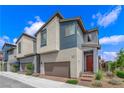 Inviting two-story home featuring clean lines, a red door, and a well-maintained landscape at 3192 Timorasso Ave, Henderson, NV 89044