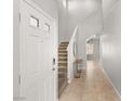 Home entryway with tile floors, neutral paint, and staircase at 382 Scarlet Pine Ct, Henderson, NV 89044