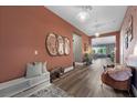 Stylish entryway with wood floors, decorative mirrors, and modern lighting at 4310 Lailah Skye Ave, Las Vegas, NV 89141